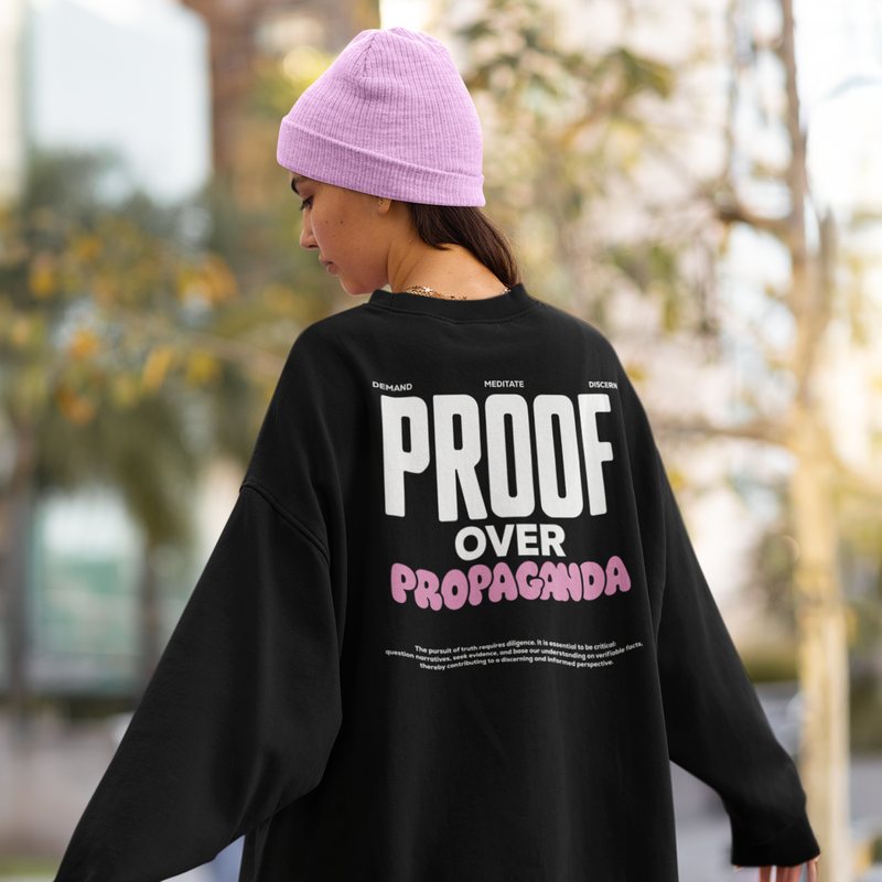 Person seen from behind wearing a black crewneck with a large white and pink back print